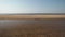 Ribbed sand - Baltic sea gulf beach with white sand in the sunset - 4K video with slow camera movement and inner