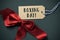 Ribbon bow and text boxing day in a swing tag