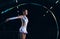 Ribbon gymnastics, woman and serious dancer in talent show, competition and dark mockup arena. Focused female athlete