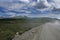 ribbon of the road among the slopes of the mountains on the expanses of Altai on a summer day