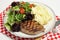 Ribeye steak with salad and celeriac potatoes