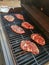 Ribeye steaks cooking on grill