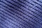 Ribs pattern on purple handmade knitted fabric