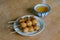 Rice balls on a stick with green tea cup