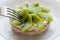 Rice biscuit with cheese and kiwi.