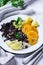 Rice with black beans, fried tostones, plantains, guacamole sauce