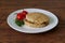 Rice burger on a white crockery on a wooden table.