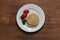 Rice burger on a white crockery on a wooden table.