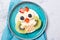 Rice cakes with yoghurt and fresh fruits in a shape of cute owls, meal for kids idea, top view