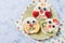 Rice cakes with yoghurt and fresh fruits in a shape of cute owls on a plate, meal for kids idea, top view