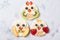 Rice cakes with yoghurt and fresh fruits in a shapes of cute owls, meal for kids idea, top view