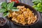 Rice with chicken meat, pineapple and sesame seeds on wooden table. Indian cuisine. Top view.