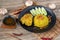 Rice with curried chicken. Delicious spicy chicken biryani in black bowl on wooden background, Indian or Pakistani ramzan food. Ho