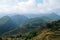 Rice farming with farmer cabin on Vietnam mountainrange