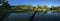 Rice field with mountain and palmtrees reflection panorama