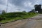 Rice fields beside the trawas mojokerto indonesian rural road. under a cloud that is starting to get cloudy.