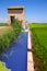 Rice fields in Valencia with irrigation and warehouse