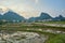 Rice fiels near sunset with mountains in the background in Phong Nha Ke Bang national park, Vietnam. With copyspace.