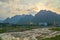 Rice fiels near sunset with mountains in the background in Phong Nha Ke Bang national park, Vietnam. With copyspace.