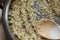 Rice frying and oiling in ghee  on steel pan closeup, process of cooking asian indian basmati ghee rice