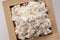 Rice koji in a box placed on a white background. Koji mold. Koji is fermented rice
