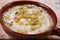 Rice Mahalabia topping with nuts powder served in dish isolated on table top view of arabic dessert