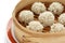 Rice meatballs in the bamboo steamer , chinese fo