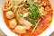 Rice noodle with pork ball in tom yum spicy soup topping fresh bean sprout on bowl