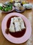 Rice noodle roll on a plate served as dim sum