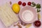 Rice noodles,  clove of garlic, empty pink bowl, lemon slices: cooking ingredients