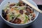 Rice noodles stir fry in bowl with ear wood mushrooms, vegetables