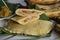 Rice plantain Ila ada. Steamed rice pancakes in banana leaf made with a rice flour dough mixed with mashed ripe plantain and sweet