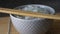 Rice in a porcelain bowl, with Japanese chopsticks, soy sauce, served on a gray stone table Close up