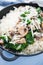 Rice risotto with mushrooms, parmesan and spinach close up on blue wooden background