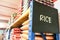 Rice signage with stacks of rice on shelf of supermarket