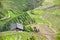 Rice terraces in Longsheng China. Workers with horses in agrarian fields.