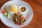 Rice topped fried egg with stir-fried pork and basil
