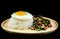 Rice topped spicy fried pork with basil leaves topping Fried Eggs on wooden dish