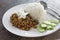 Rice topped with Stir Fried Pork with yellow curry paste