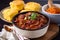 Rich and Bold Chili Con Carne Served with Cornbread Muffins and Jalapeno Slices