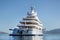 Rich - front view of five story luxury yacht on the Mediterranean Sea