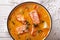 Rich salmon soup with thyme close-up on the table. horizontal to