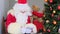 Rich santa claus with white beard counts paper banknotes, money, christmas concept, waiting for gifts, new year celebration,