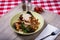 Rich Seafood Pasta on Wooden Board With Red Checkered Tablecloth