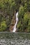 Rich waterfall in forest draining into Koenigssee