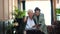 Rich wealthy happy Asian elder couple invest business through smartphone in luxury home