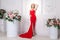 Richly lady with red long dress, jewelry and blonde wavy hair, p