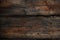 Richly textured old wood on a dark backdrop, oozing character