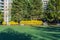 RICHMOND, CANADA - APRIL 01, 2020: Springtime view of big green field in front of huge apartment buildings complex