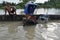 A rickshaw is left over on a flooded bridge in Pathum Thani, Thailand, in October 2011